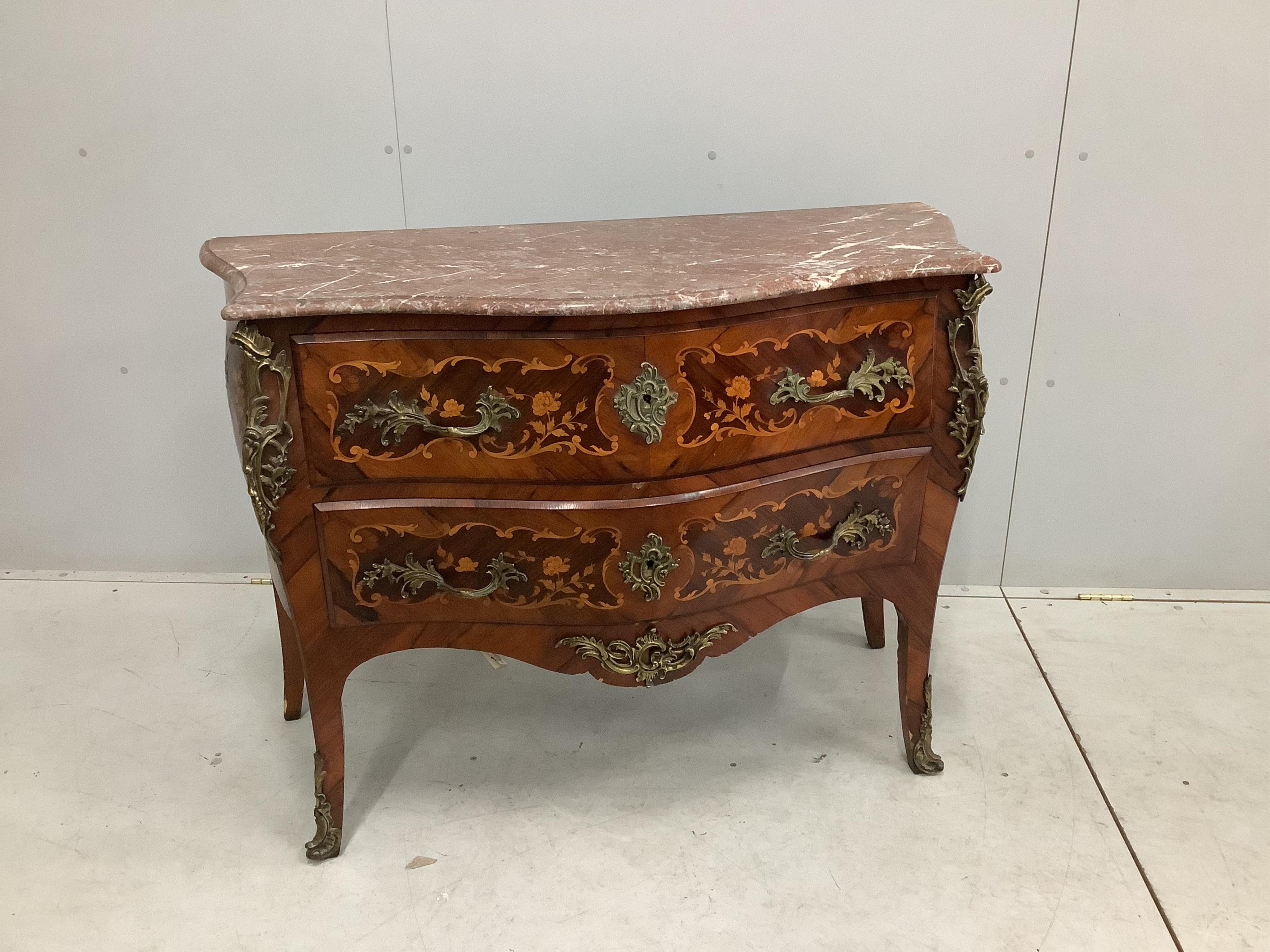 A French gilt metal mounted and marquetry inlaid kingwood marble topped serpentine commode, width 116cm, depth 51cm, height 85cm. Condition - fair to good